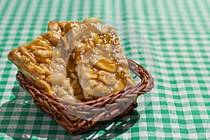 Candy with peanut: Pe de Moleque in Brazil and Chikki in India. photo