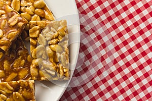 Candy with peanut: Pe de Moleque in Brazil and Chikki in India. photo