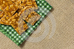 Candy with peanut: Pe de Moleque in Brazil and Chikki in India. photo