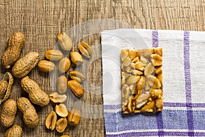 Candy with peanut: Pe de Moleque in Brazil and Chikki in India. photo