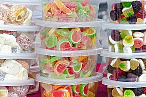 Candy in plastic containers on the market