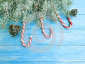 Candy, snow bump festive template holiday design on a wooden background, Christmas tree