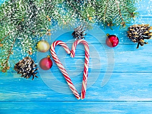 Candy, snow bump frame seasonal traditional greeting on a wooden background, Christmas tree
