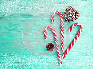 Candy, snow bump on a wooden background, christmas
