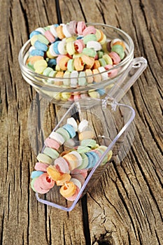 Candy on strings on wooden background