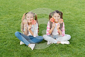 Candy synonym for happiness. Sugar and calories. Joyful cheerful friends eating sweets outdoors. Holiday food. Sweet
