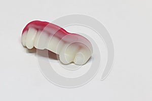 Candy teeth on white background