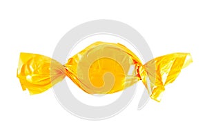 Candy in yellow, wrapper isolated