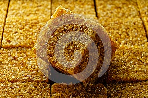 Cane sugar cube macro image. Sugar cube on top of other cubes in pack