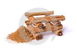 Canella sticks and powder on a white background. Cinnamon spices. photo