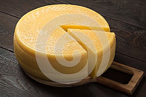 Canestrato cheese on a wooden board