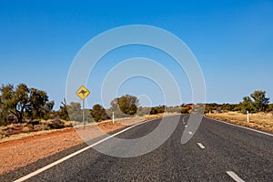 Cangaroos, road sign by the road in the Red Center, Australia