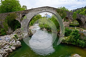 Cangas de Onis, mountain village with old roman ruins and bridge, Picos de Europa mountains, Asturias, North of Spain photo