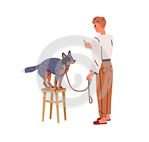 Canine trainer teaching dog. Pet owner training sit down command with purebred doggy, gesturing to puppy with finger