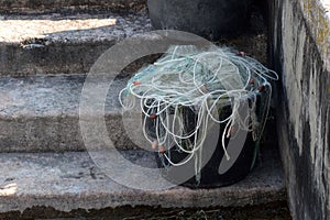 Canister with fishing net