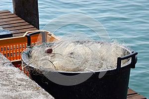 Canister with fishing net