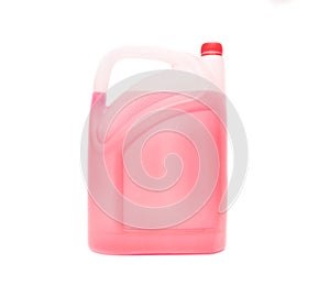 Canister with red antifreeze on a white background, isolate, coolant, close-up photo