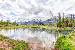 Canmore`s Three Sisters mountain peaks at Policeman Creek in the Canadian Rockies