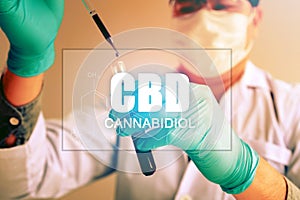 Cannabis oil, CBD concept, Chemist conducts experiments by synthesising compounds with using dropper in a test tube