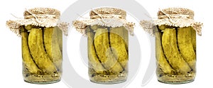 Canned cucumbers in glass jars. Appetizing traditional snack. Isolated on a white background