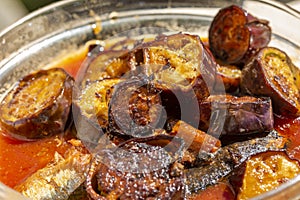 Canned fish curry with fried egg plants.