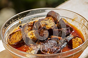 Canned fish curry with fried egg plants.