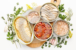 Canned fish in tomato and oil, many cans
