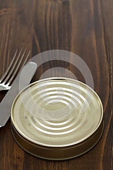 Canned food on brown background