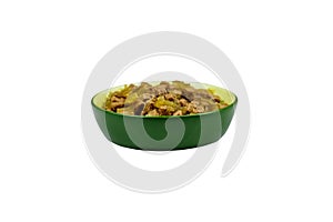 Canned food for cats or dogs in ceramic green bowl isolated on white background