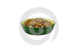 Canned food for cats or dogs in ceramic green bowl isolated on white background