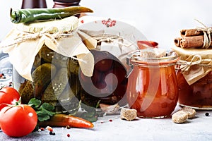 Canned food concept. Fermented, pickled, marinated preserved vegetarian food. Organic vegetables and fruits in jars with spice and