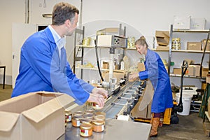 Canned food factory workers at work