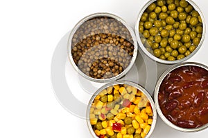 Canned food on white background. Green pea, beans, corn, lentils