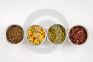Canned food on white background. Green pea, beans, corn, lentils