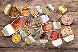 Canned food on wooden background