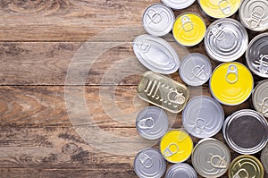 Canned food on wooden background