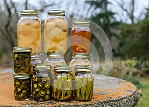 Canned fruit and vegetables in glass jars