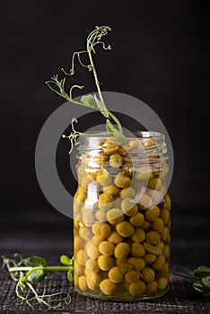 canned green peas in a glass jar