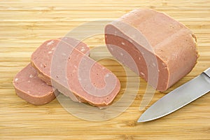 Canned luncheon meat with knife