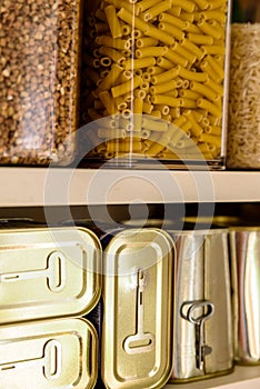 Canned meat food cans stored on kitchen shelf