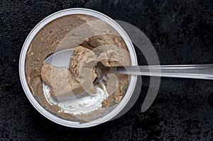 Canned meat pate with a spoon