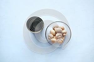 Canned mushrooms in blow on white background