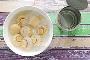 Canned mushrooms in blow on white background