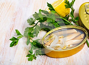 Canned natural mollusks Solen with parsley and lemon