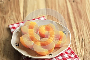 Canned Peach Halves in Ceramic Plate