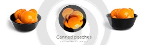 Canned peaches in a black bowl. Sweet peaches in syrup isolated on white background.