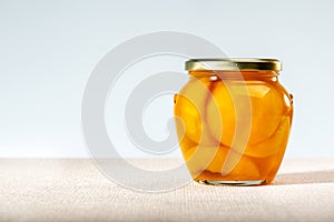 Canned peaches in glass jar