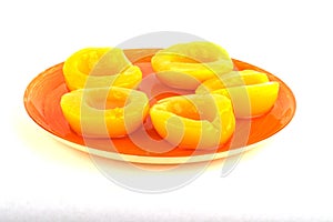 Canned peaches on white background