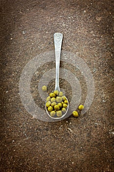 Canned peas in spoon