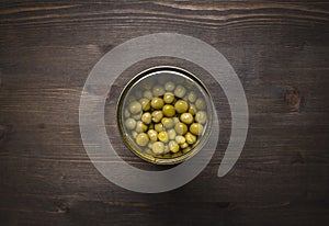 Canned peas wooden rustic background top view close up